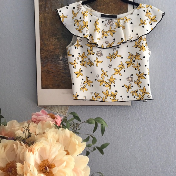 white blouse with yellow flowers